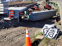 View of deck panel installation for the temporary Station 46 Bridge, looking south towards the Taste of Maine Restaurant.